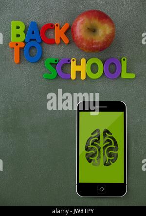 Digital composite of Phone on a school table with brain icon on screen Stock Photo
