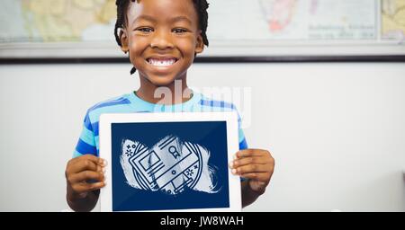 Digital composite of Boy holding a tablet with school icons on screen Stock Photo