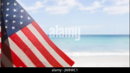 Digital composite of USA flag in the beach Stock Photo