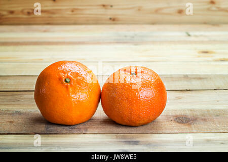 Fresh oranges on wooden table Stock Photo