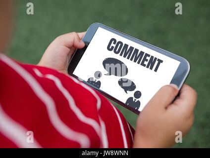 Digital composite of Comment text and chat graphic on phone screen with hands Stock Photo