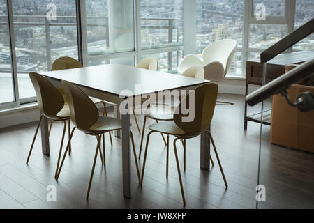 View of dining table in living room at home Stock Photo