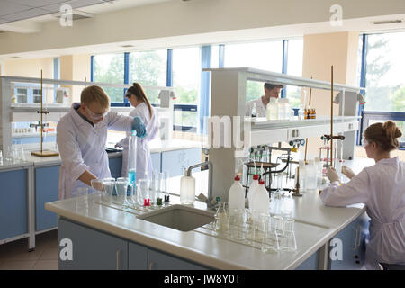 University students practicing experiment in lab Stock Photo