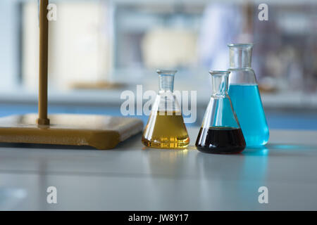Close up of chemicals in beaker on table Stock Photo