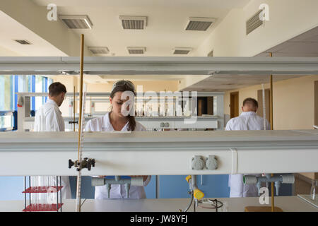 Young college students practicing experiment in lab Stock Photo
