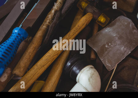 Various tools on worktop in workshop Stock Photo