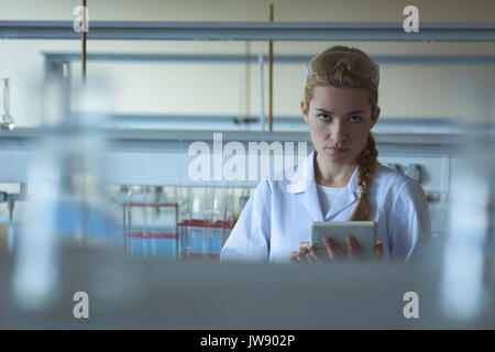 Portrait of university student using digital tablet in laboratory Stock Photo