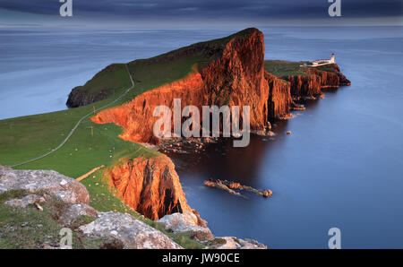 Neist Point, Isle of Skye, catching the late evening light along the cliffs, glowing in the light of the setting sun. Stock Photo