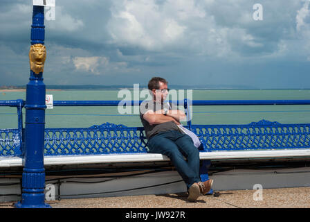 A series of photographs based on Eastbourne Pier, through sunshine and rain. A typical British summer's day with colour, reflections and people. Stock Photo