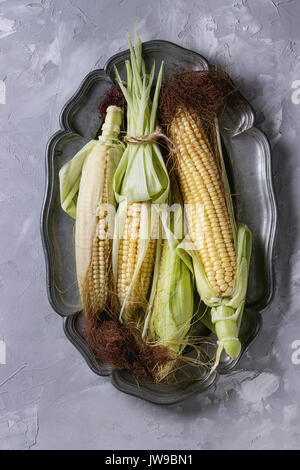 Young raw corn cobs Stock Photo