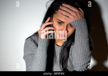 close up of crying woman calling on smartphone Stock Photo - Alamy