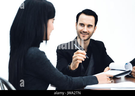 Manager businessman and assistant Secretary in his office. The Secretary brought the boss documents to sign during meeting. Stock Photo