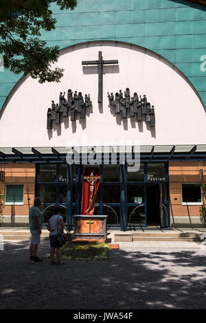 Front entrance to the passion theatre in Oberammergau with crucifix on display outside, Garmisch Partenkirchen, Bavaria, germany Stock Photo