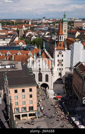 Looking down from the clock tower of the neues rathaus, new town hall, towards the alte rathaus, old town hall, Marienplatz, marien square, Munich, Ba Stock Photo