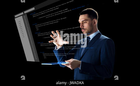 businessman with tablet pc and virtual coding Stock Photo