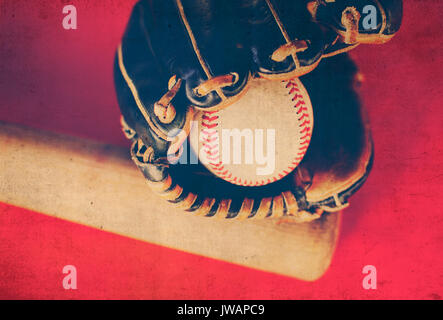 Vintage style image of baseball bat, ball glove and old leather ball for sports background.  Shows game equipment. Stock Photo