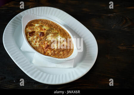 scrambled eggs with mushrooms and vegetables in a frying pan Stock Photo