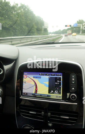 Car navigation system build in interior of modern european car with GPS system on. Netherlands. Stock Photo