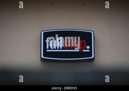 Full stop company sign on a wall Stock Photo