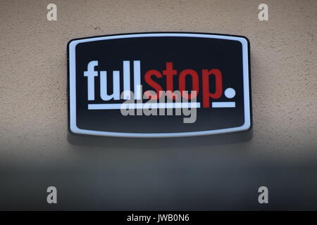 Full stop company sign on a wall Stock Photo