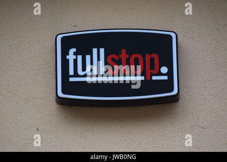 Full stop company sign on a wall Stock Photo