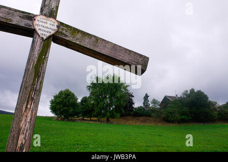 Jura countryside landscape with a catholic wayside cross, Jura (France) Stock Photo