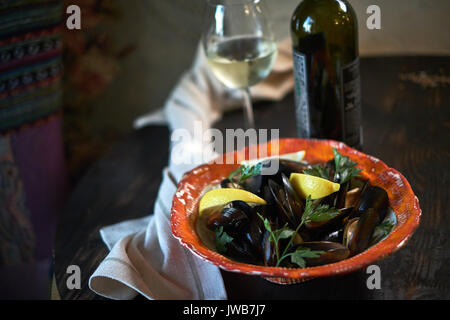 Mussels on ice ready to cook with lemon and white wine jpg Stock Photo