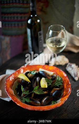 Mussels on ice ready to cook with lemon and white wine jpg Stock Photo