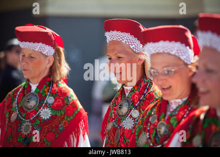 TALLINN, ESTONIA - 04 JUL 2014: People in Estonian costumes going at ceremonial procession of Estonian song and dance festival Stock Photo