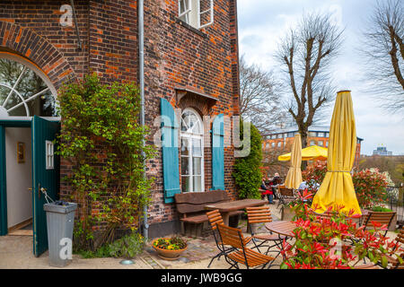 The cafe near old brick windmill. Bremen, Germany Stock Photo