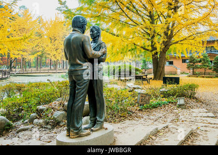 NAMI ISLAND,KOREA - OCT 25: The statue and Tourists taking photos of the beautiful scenery around Nami Island on October 25,2015 in seoul,South Korea. Stock Photo