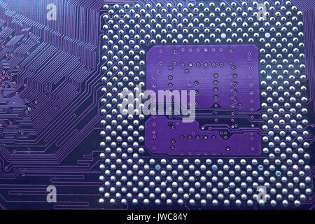 closeup of central processor unit socket on the back side of computer motherboard main board Stock Photo