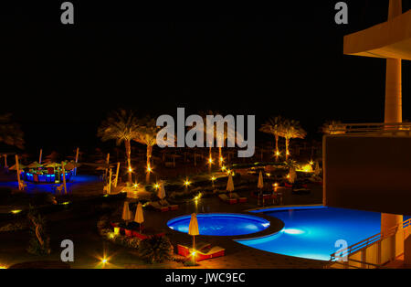 Sharm El Sheikh, Egypt - April 7, 2017: Evening view of swimming pool at luxury hotel Barcelo Tiran Sharm 5 stars at night Stock Photo