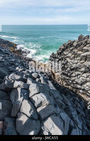 Hexagonal basalt column by the sea, Blackhead, Dunedin, Otago, South Island, New Zealand Stock Photo