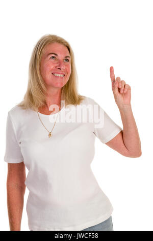 cheerful middle-aged woman pointing up empty copyspace Stock Photo