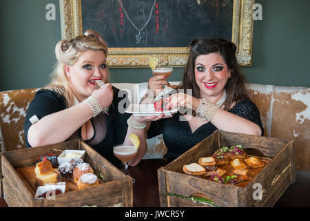 Kyloe launches National Afternoon Tea Week with Gilded Balloon act, 'Mothers Ruin: A Cabaret About Gin’, savouring Kyloe's take on the traditional. Stock Photo