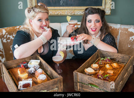 Kyloe launches National Afternoon Tea Week with Gilded Balloon act, 'Mothers Ruin: A Cabaret About Gin’, savouring Kyloe's take on the traditional. Stock Photo