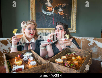 Kyloe launches National Afternoon Tea Week with Gilded Balloon act, 'Mothers Ruin: A Cabaret About Gin’, savouring Kyloe's take on the traditional. Stock Photo