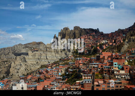 Brick housing on a steep hillside, and eroded hill, La Paz, Bolivia, South America Stock Photo