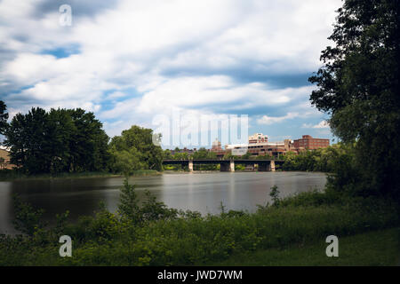 Long exposure of Rochester New York with Genesee river in foreground Stock Photo