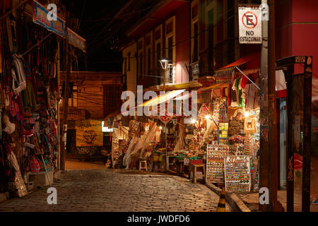 Shops selling Bolivian handicrafts along Linares at night, Witches Market, La Paz, Bolivia, South America Stock Photo