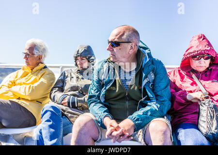 Perce, Canada - June 6, 2017: People tourists sitting on boat tour in Gaspe Peninsula, Quebec, Gaspesie region Stock Photo