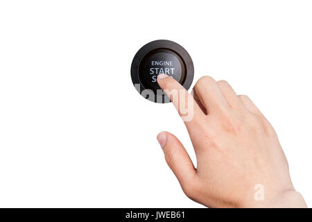 Close up of finger pressing the start/stop engine button on a car. Stock Photo