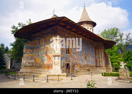 Mural frescoes on exterior walls of Voronet Monastery Church, known as The Sistine Chapel of the East (Unesco Heritage Site) Stock Photo