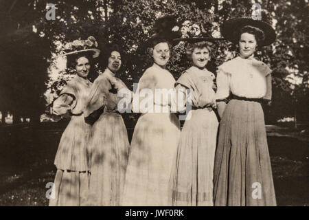 Women with big hats in Minnesota USA 1907-1908 having fun Stock