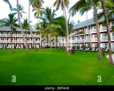 Punta Cana, Dominican republic - February 04, 2013: The Barcelo Bavaro Beach hotel under palms Stock Photo