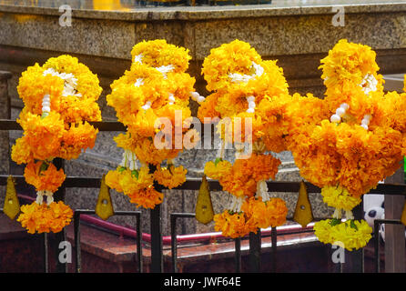 Praying flowers at Erawan Temple in Bangkok, Thailand. Erawan houses a statue of Phra Phrom, the Thai representation of the Hindu god of creation Lord Stock Photo