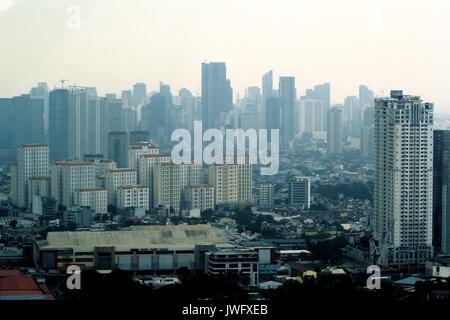 METRO MANILA, PHILIPPINES - AUGUST 8, 2017: Commercial and residential buildings and structures in the cities of Pasig, Mandaluyong and Makati. Stock Photo