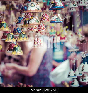 Ceramic bells as a souvenir in local traditional market. Stock Photo