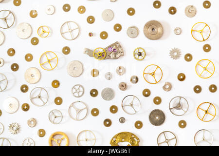 watchmaker workshop - ornament from various old watch spare parts on white background Stock Photo
